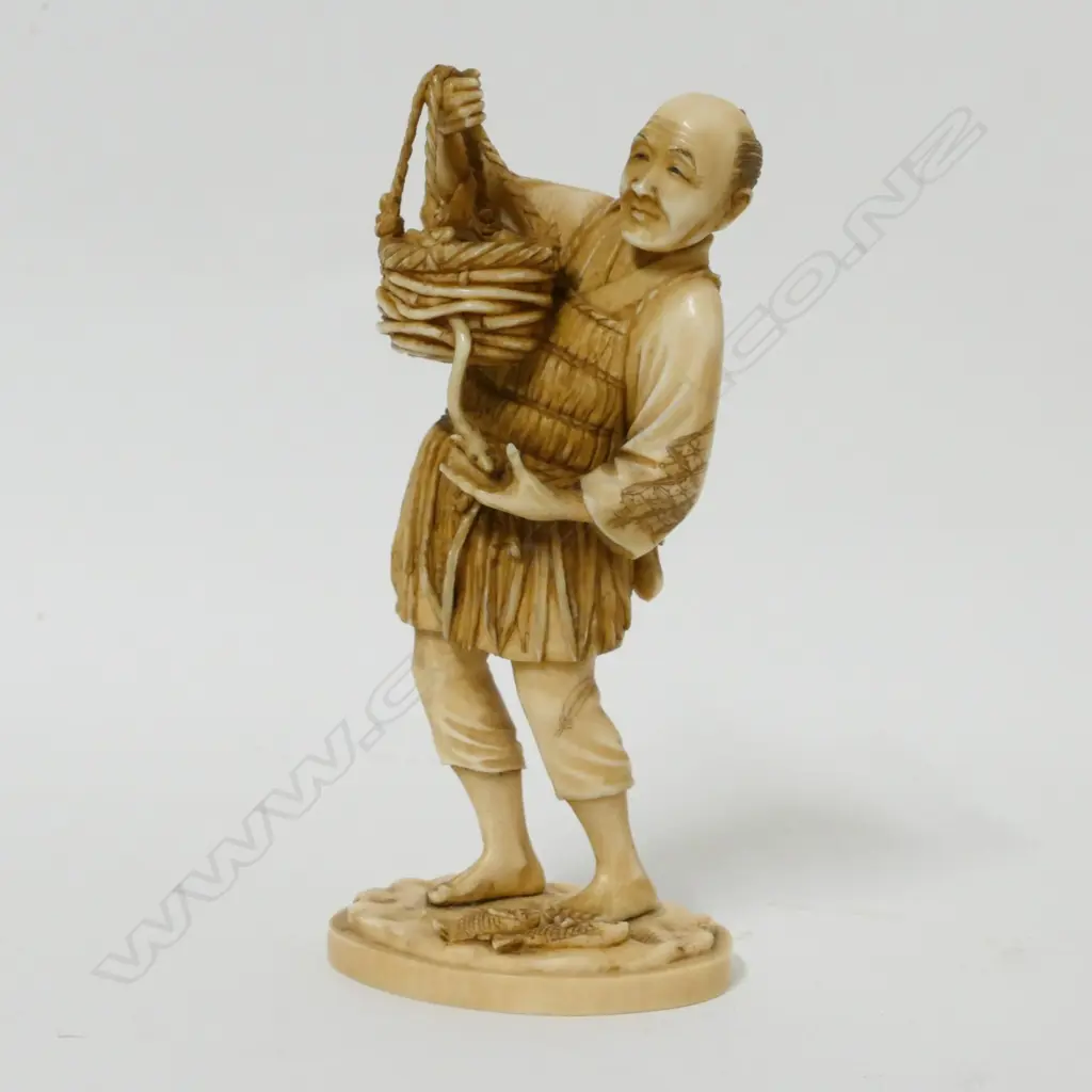 A Japanese ivory okimono of a fisherman Image 1++