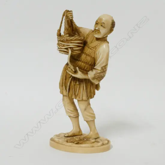 A Japanese ivory okimono of a fisherman