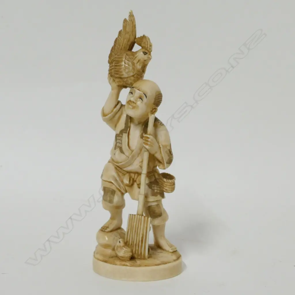 A Japanese ivory okimono of a farmer Image 1++
