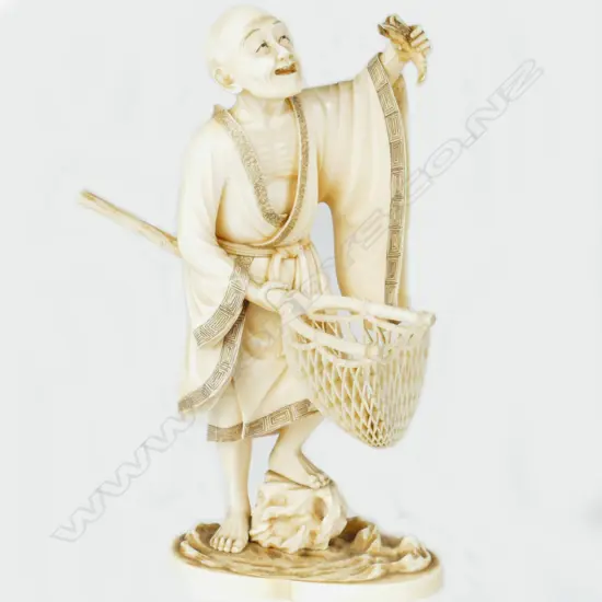 A fine Japanese Meiji period okimono of a fisherman