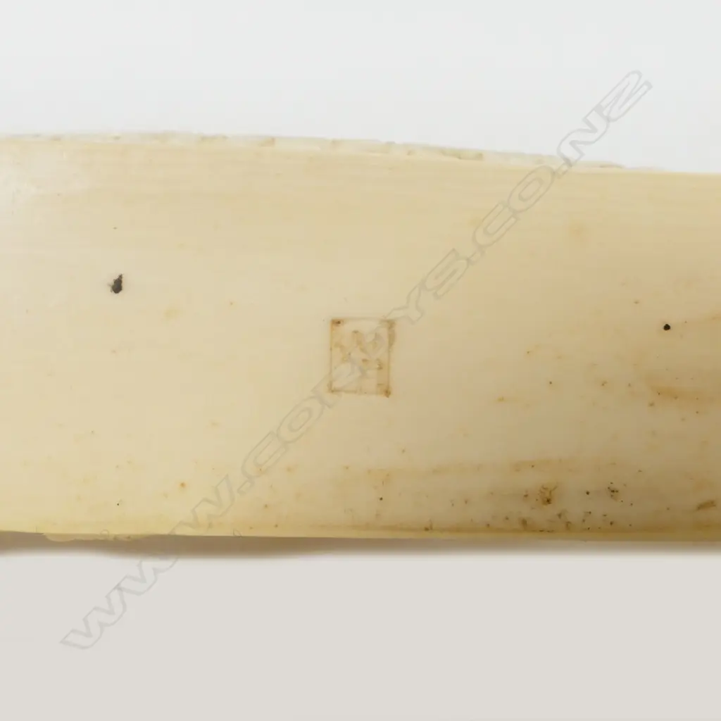 A Meiji period Japanese carved ivory okimono of a man and children playing Image 1++