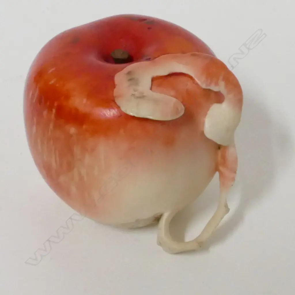 A late Meiji period Japanese ivory okimono carving in the form of a partially peeled apple Image 1++