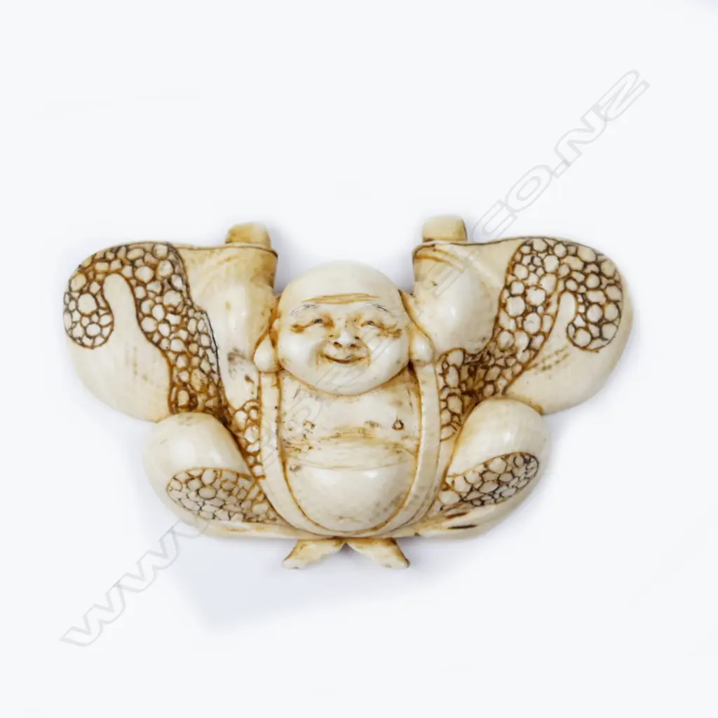 An ivory netsuke of Hotei Image 1++