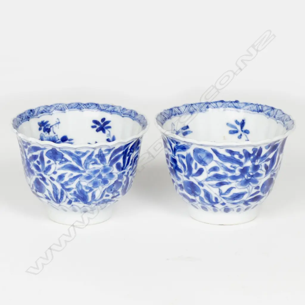 A pair of small fine quality late 19th/early 20th Century Chinese blue and white porcelain stem cups Image 1++