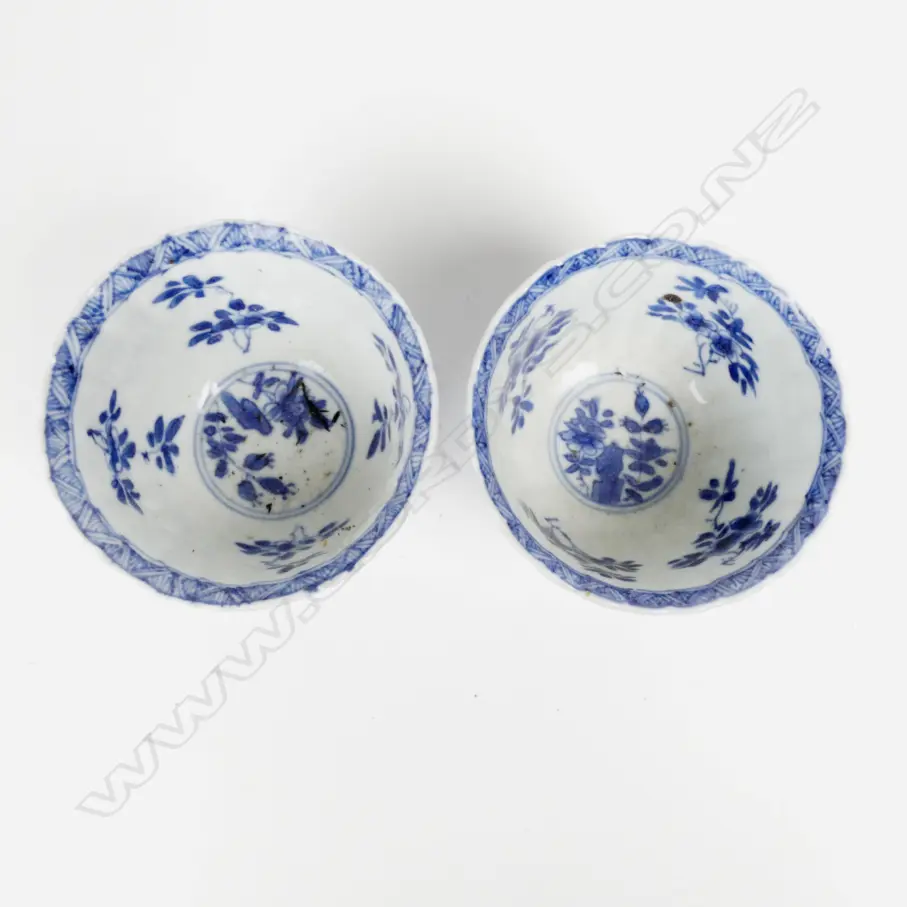 A pair of small fine quality late 19th/early 20th Century Chinese blue and white porcelain stem cups Image 1++