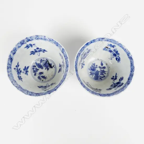 A pair of small fine quality late 19th/early 20th Century Chinese blue and white porcelain stem cups