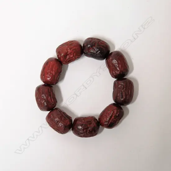 A Chinese carved Zitan wood bead bracelet