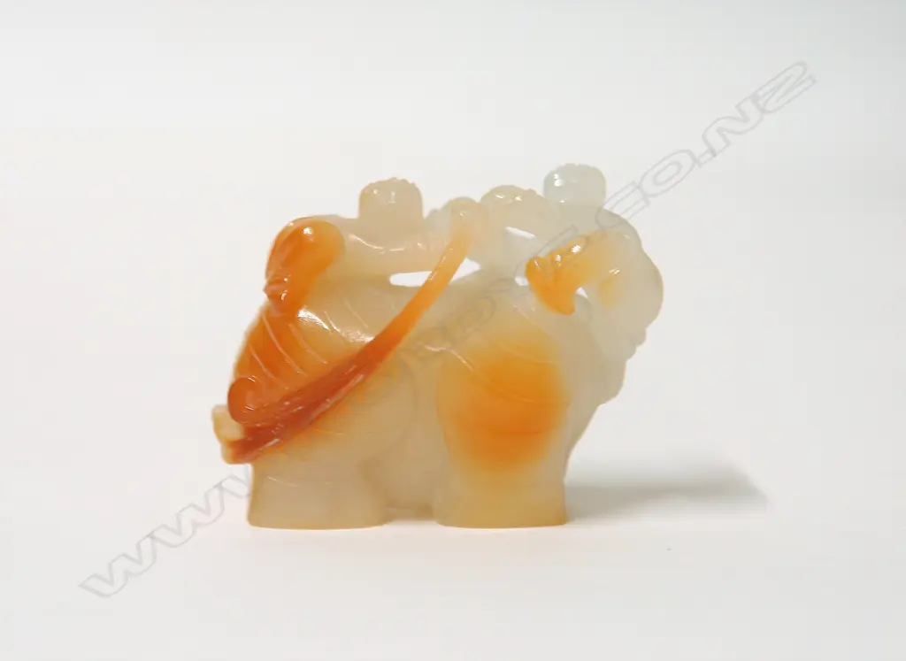 A Chinese Hotan Zi jade carved figure group of an elephant and children Image 1++