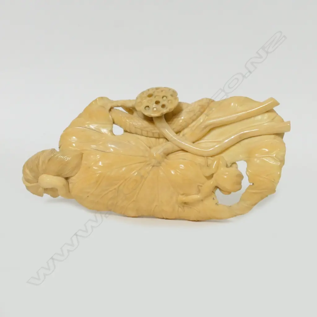 A carved ivory figure group Image 1++