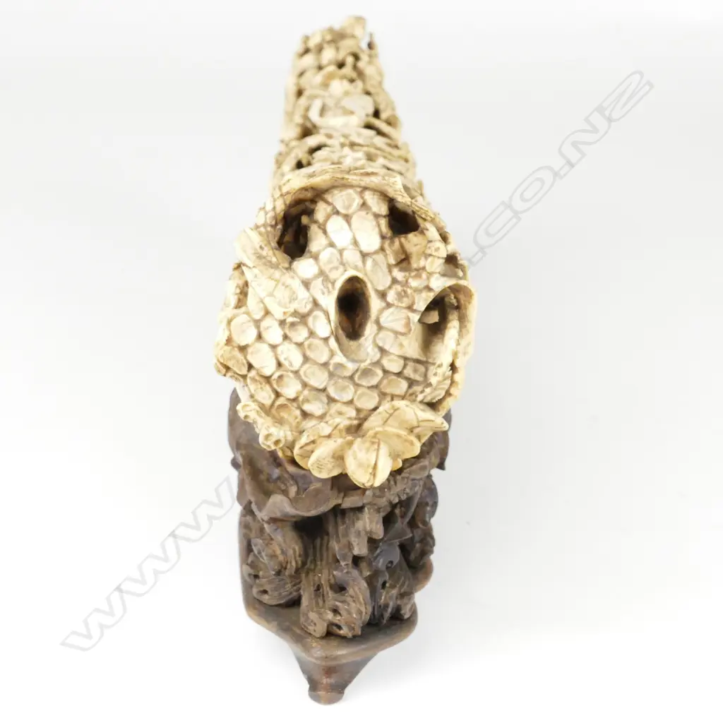 A substantial Chinese Qing period carved ivory tusk depicting the Eight Immortals voyaging to the Feast of Peaches Image 1++