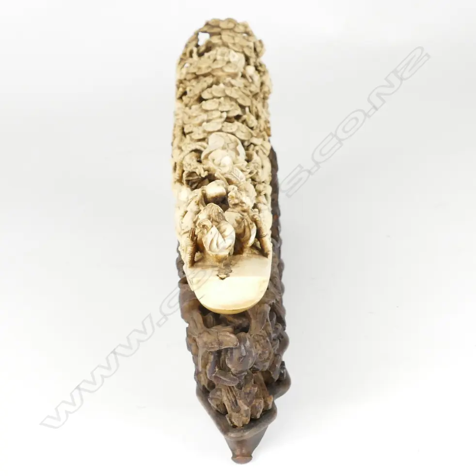 A substantial Chinese Qing period carved ivory tusk depicting the Eight Immortals voyaging to the Feast of Peaches Image 1++