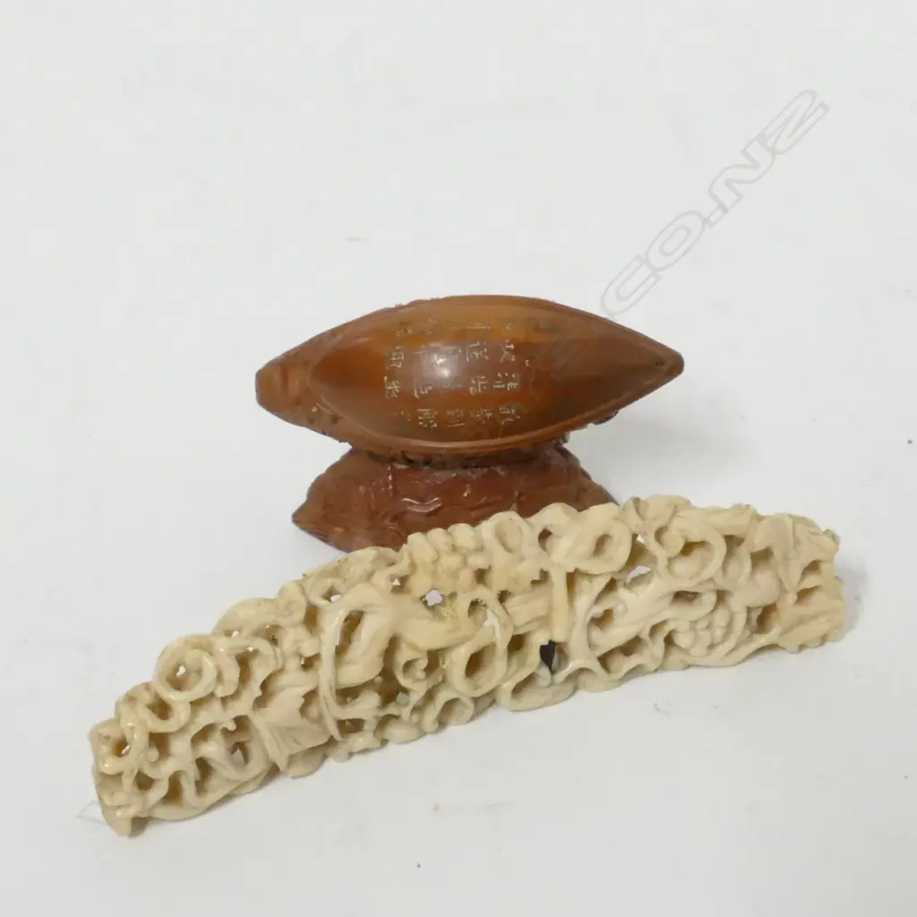 A small delicately carved ivory plaque Image 1++