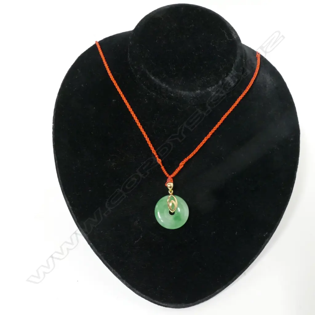 A small Chinese jade bi disc pendant Image 1++