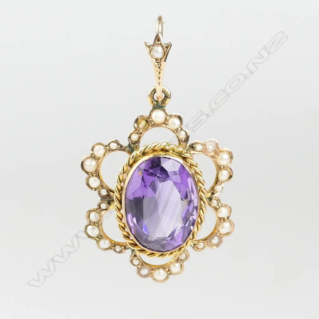 An Edwardian 9ct. gold amethyst and seed pearl pendant Image 1++