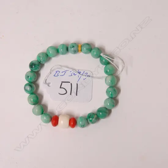 A jadeite and precious bead bracelet
