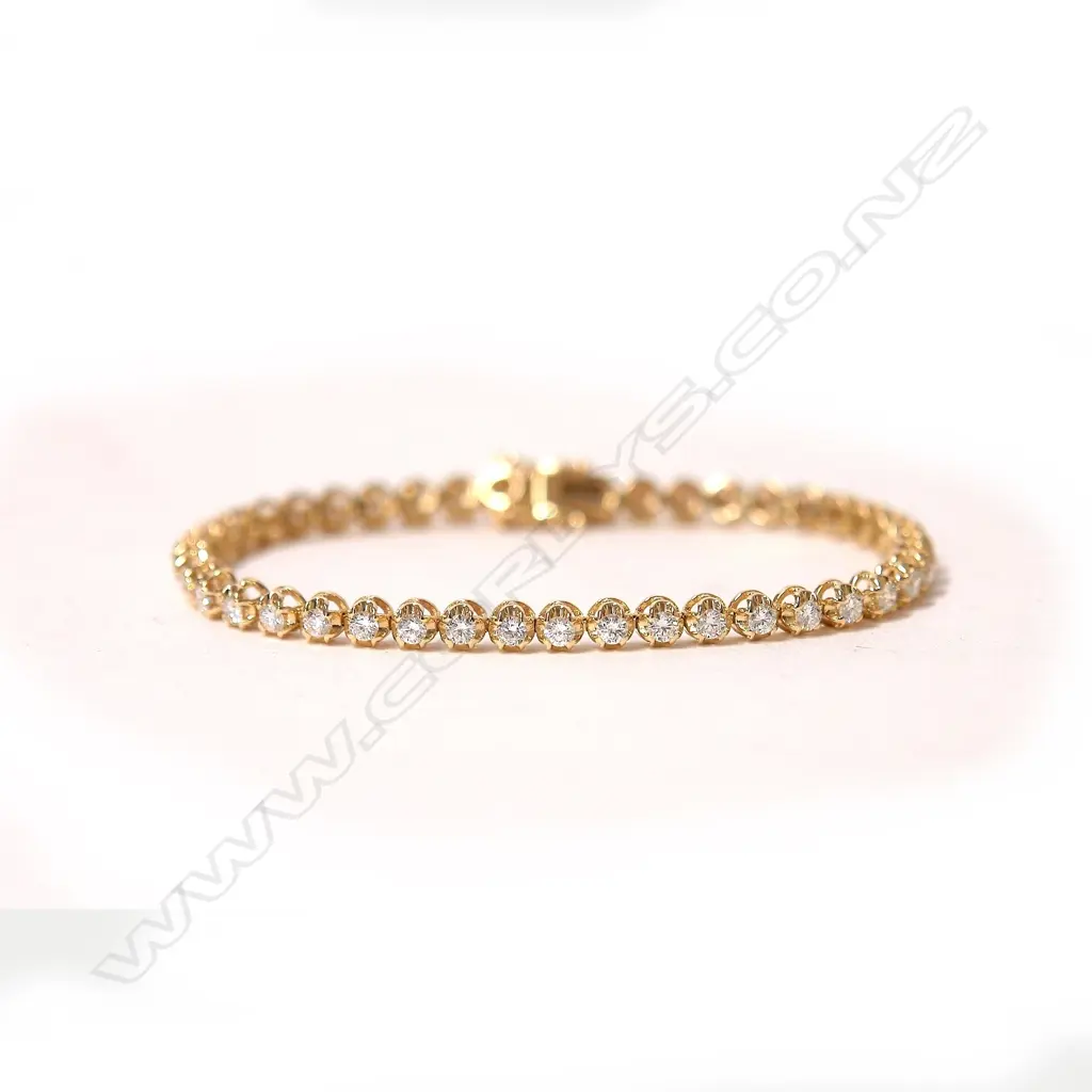 An 18ct. yellow gold and diamond set tennis bracelet Image 1++