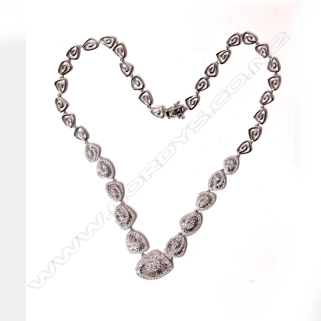 An impressive modern retro style 18ct. white gold and diamond cluster necklace Image 1++