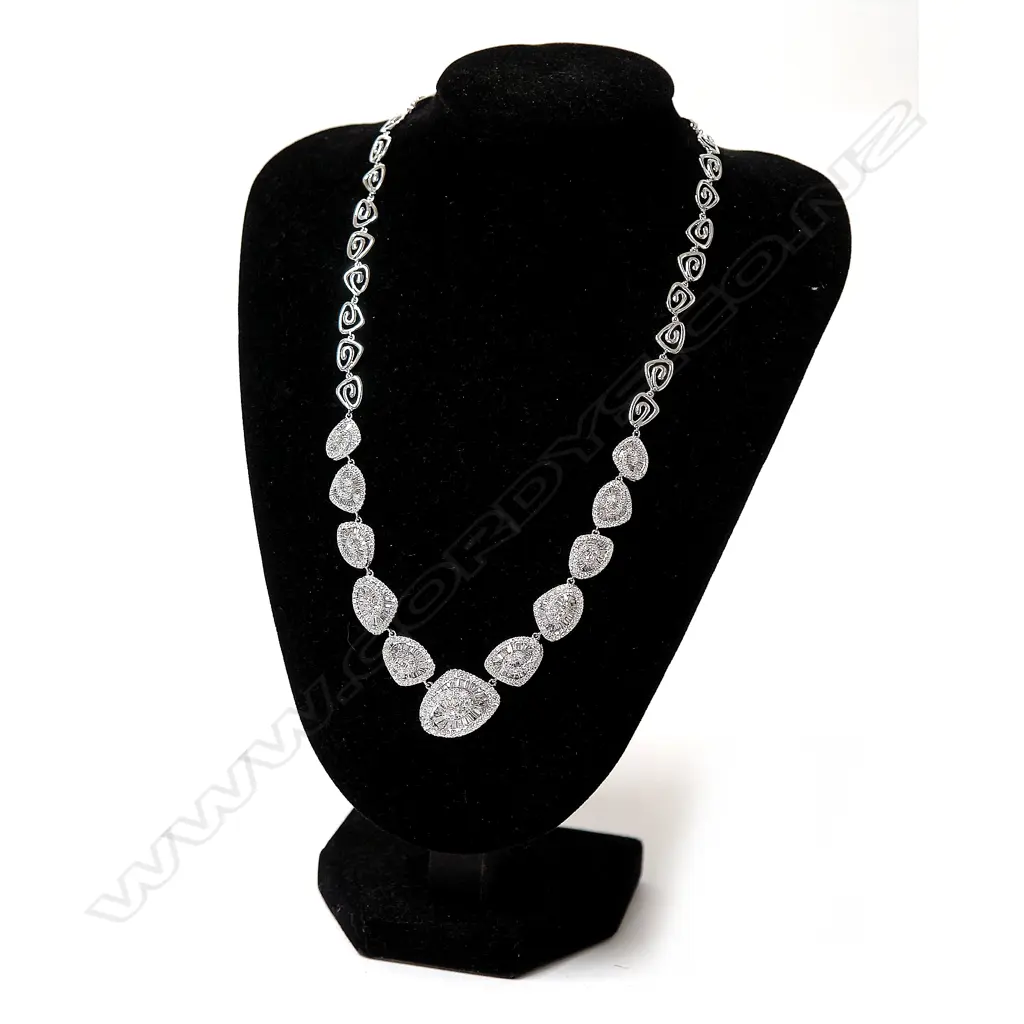 An impressive modern retro style 18ct. white gold and diamond cluster necklace Image 1++