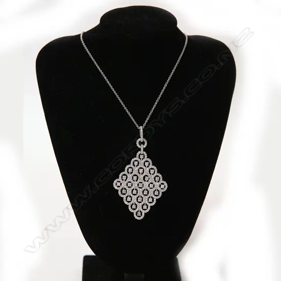 A lady's modern 18ct. white gold and large diamond set pendant necklace