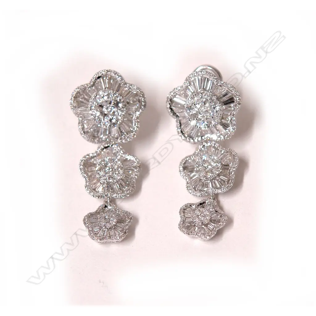A pair of 18ct. white gold and diamond set drop earrings Image 1++