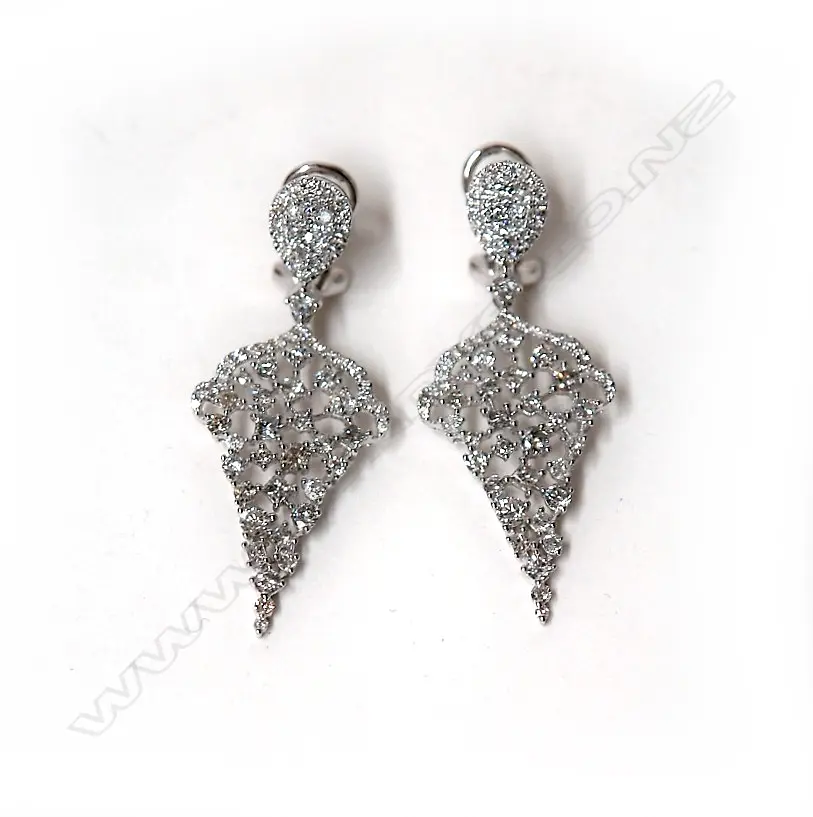 A pair of 18ct. white gold and diamond cluster pendant earrings Image 1++