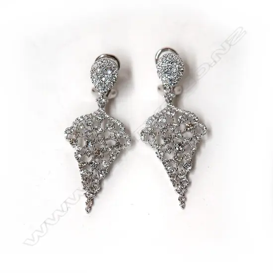 A pair of 18ct. white gold and diamond cluster pendant earrings
