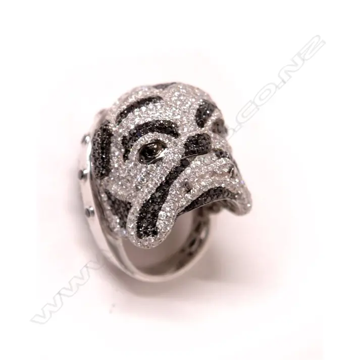 An impressive designer modern 18ct. white gold and diamond set dog head ring Image 1++