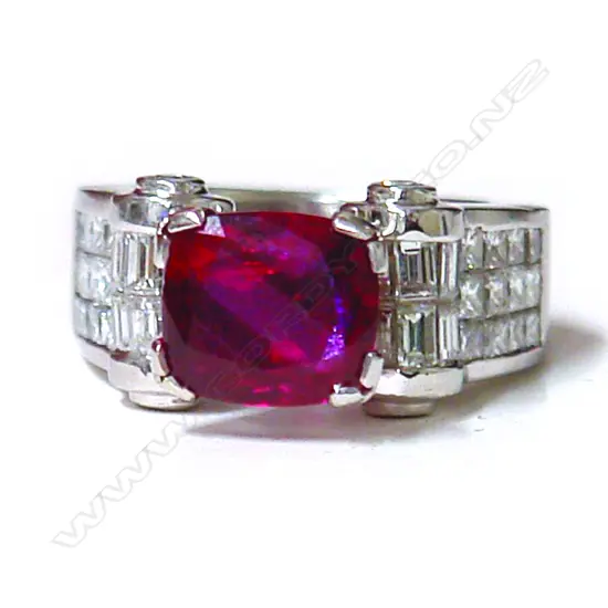 An impressive 4.01ct natural ruby and diamond substantial 18ct. gold and platinum dress ring