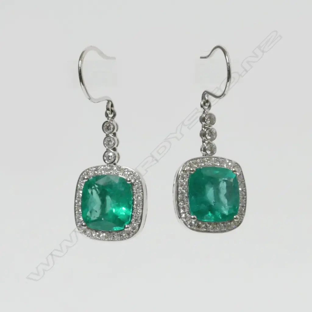 A pair of impressive 18ct white gold emerald and diamond earrings Image 1++