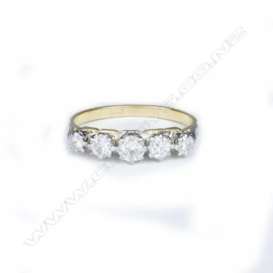 An estate 18ct. gold and five-stone diamond ring