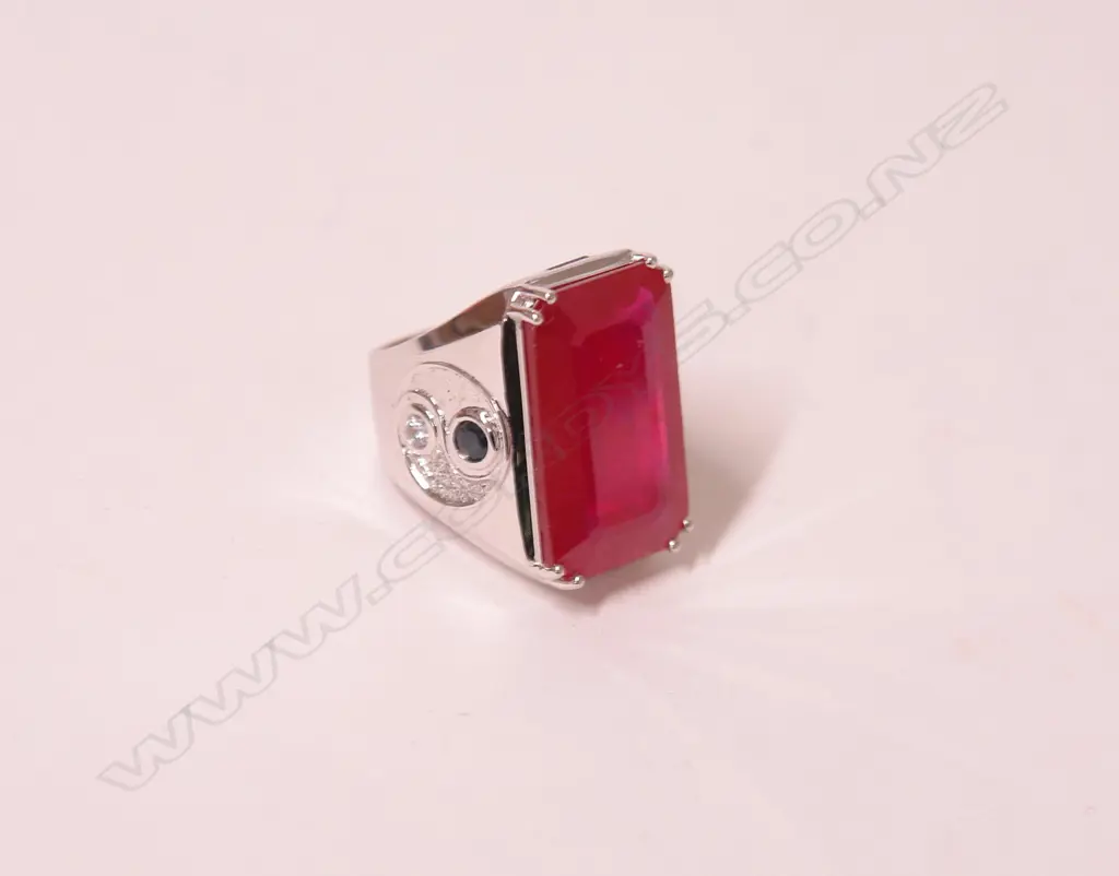 A large and impressive 18ct. white gold ruby diamond and sapphire dress ring Image 1++