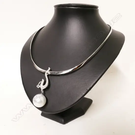 An 18ct. white gold pearl and diamond pendant