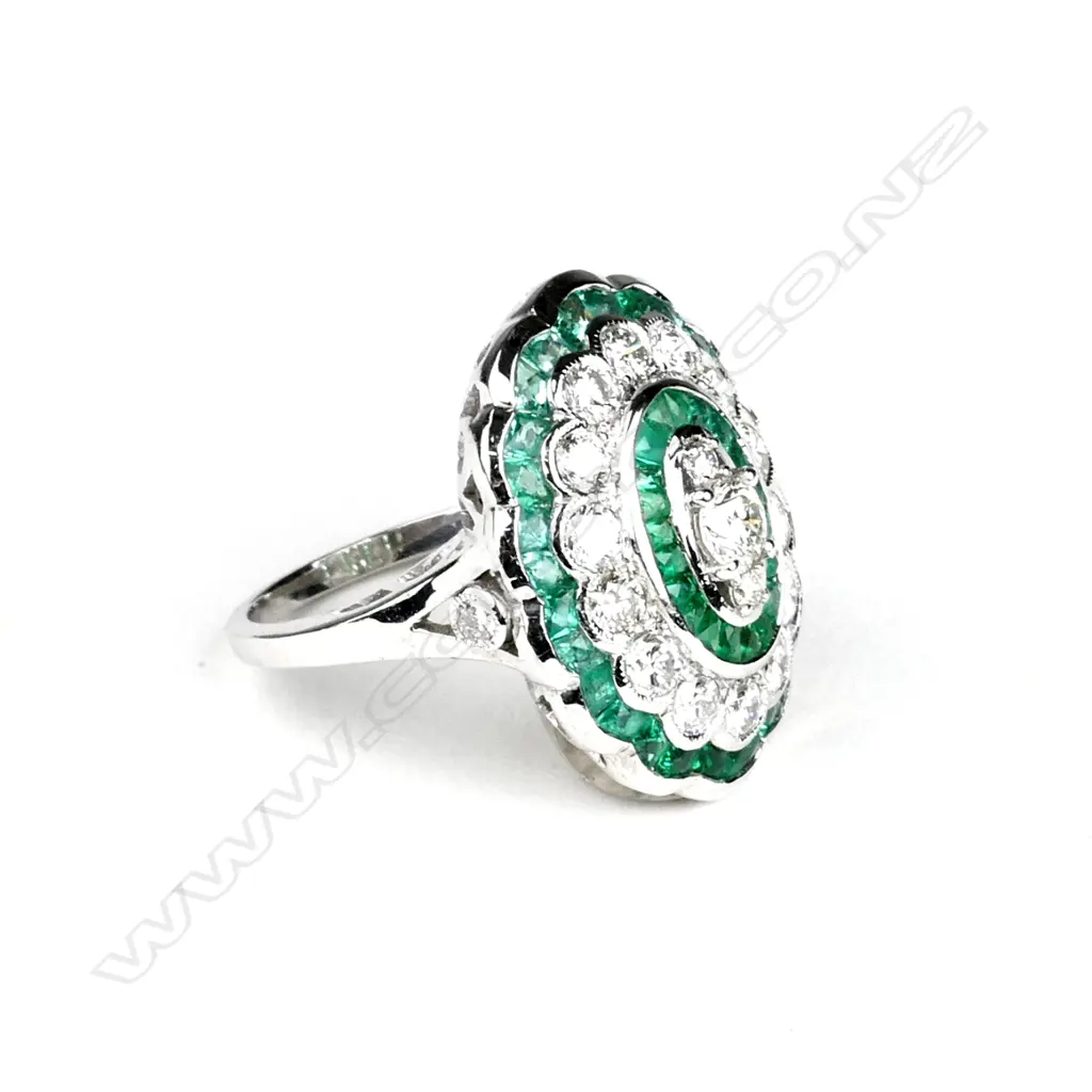 An 18ct. white gold emerald and diamond ring Image 1++