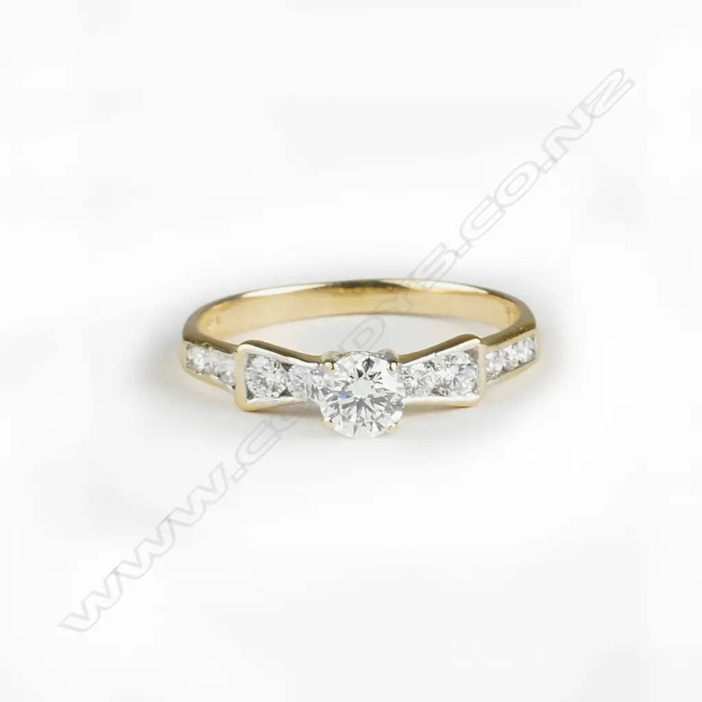 An 18ct. gold and diamond ring Image 1++