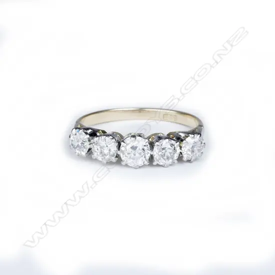 An 18ct. gold and five stone diamond ring