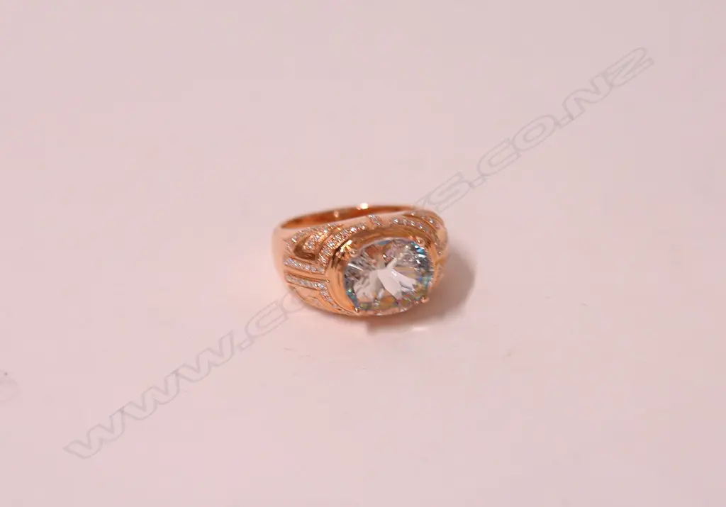 A lady's modern 18ct. rose gold aquamarine and diamond dress ring Image 1++