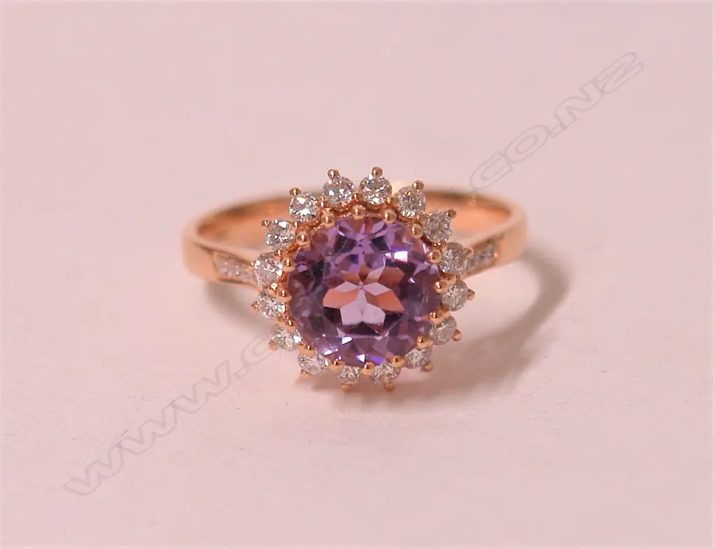 A lady's modern 18ct. rose gold amethyst and diamond dress ring Image 1++