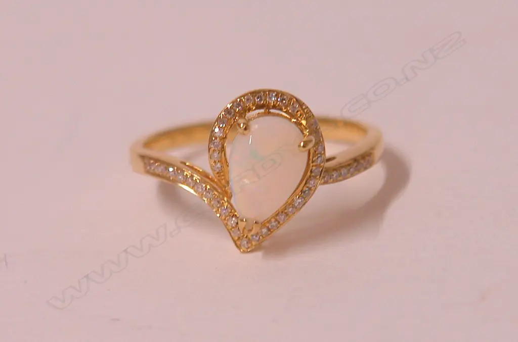 An 18ct. yellow gold opal and diamond lady's dress ring Image 1++
