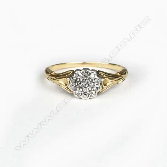 An estate 18ct. gold and diamond cluster ring