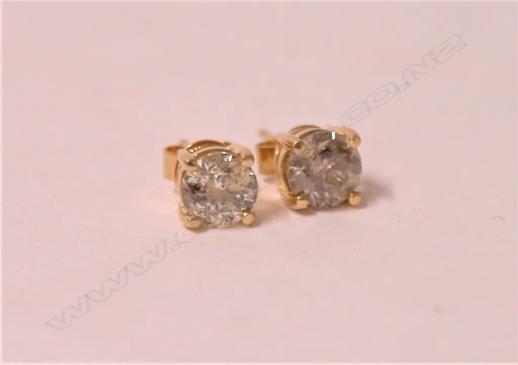 A pair of approx. 0.80ct. solitaire brilliant cut diamond earrings Image 1++