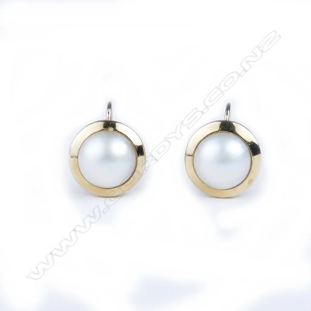 A pair of 9ct. gold and mabe pearl earrings Image 1++