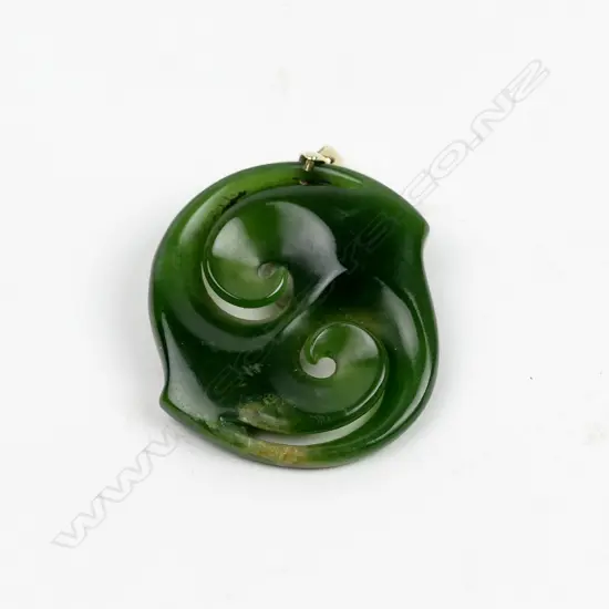 A contemporary gold and pounamu pendant