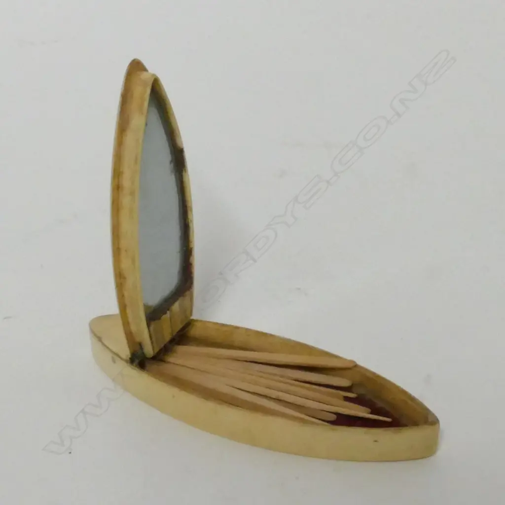 A Georgian ivory and gold mounted boat shaped tooth pick box Image 1++