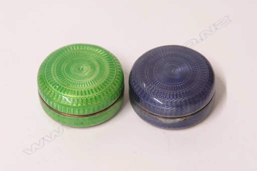 Two early 20thC silver and enamel circular vanity boxes Image 1++