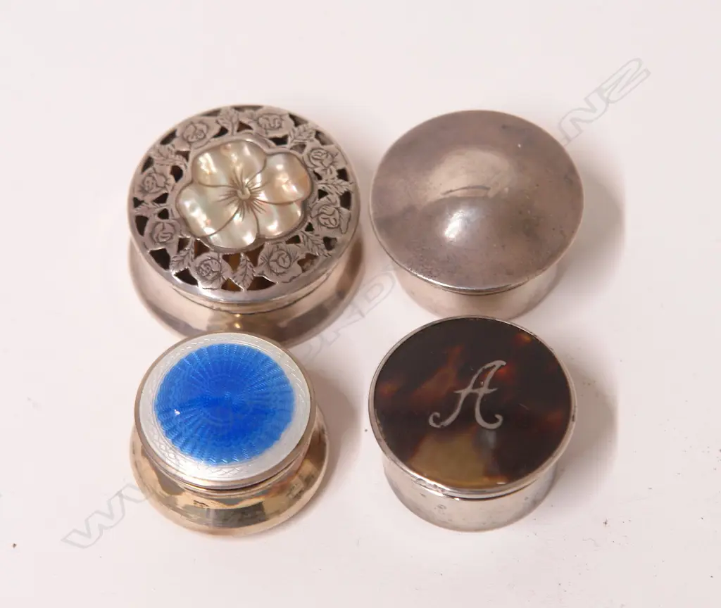 Four early 20thC small silver lidded vanity boxes Image 1++