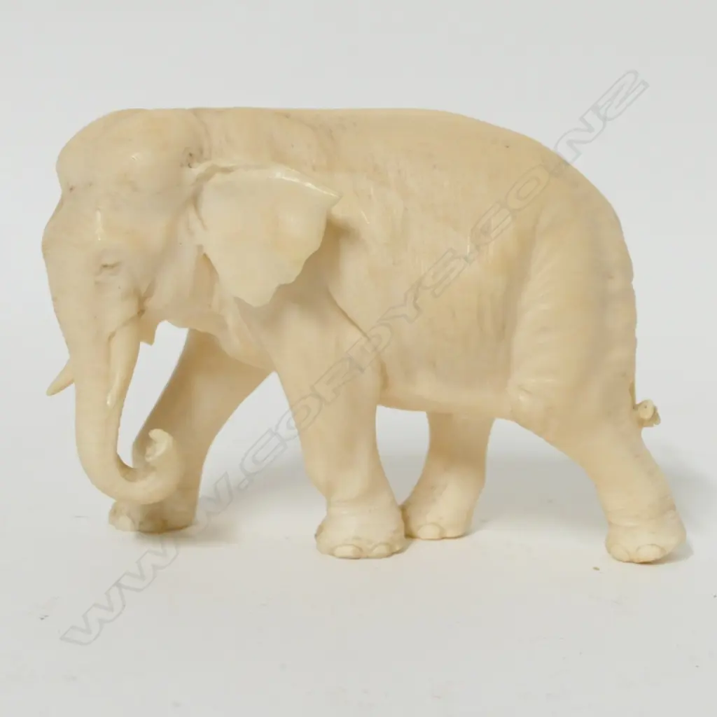 An old finely carved ivory elephant Image 1++