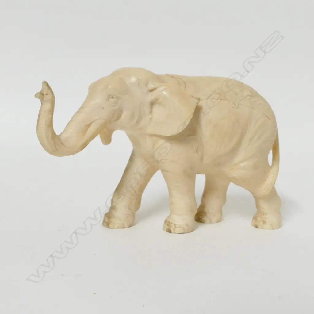 An old finely carved ivory elephant Image 1++