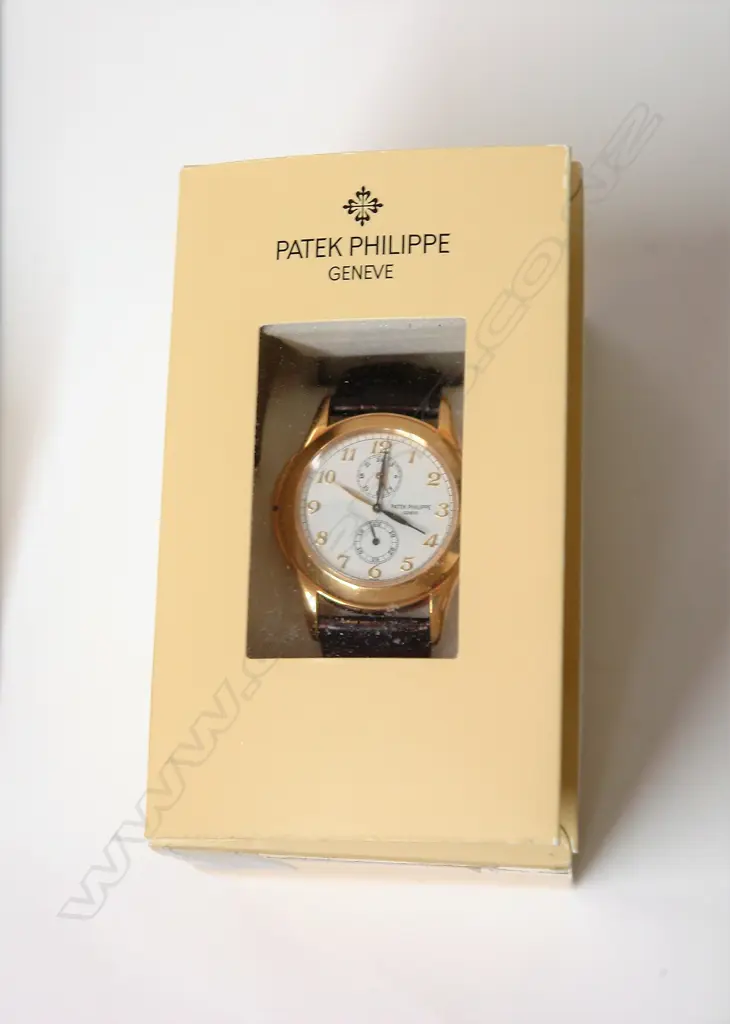A modern gent's Patek Philippe Travel-Time 5134J 18ct. gold wristwatch Image 1++