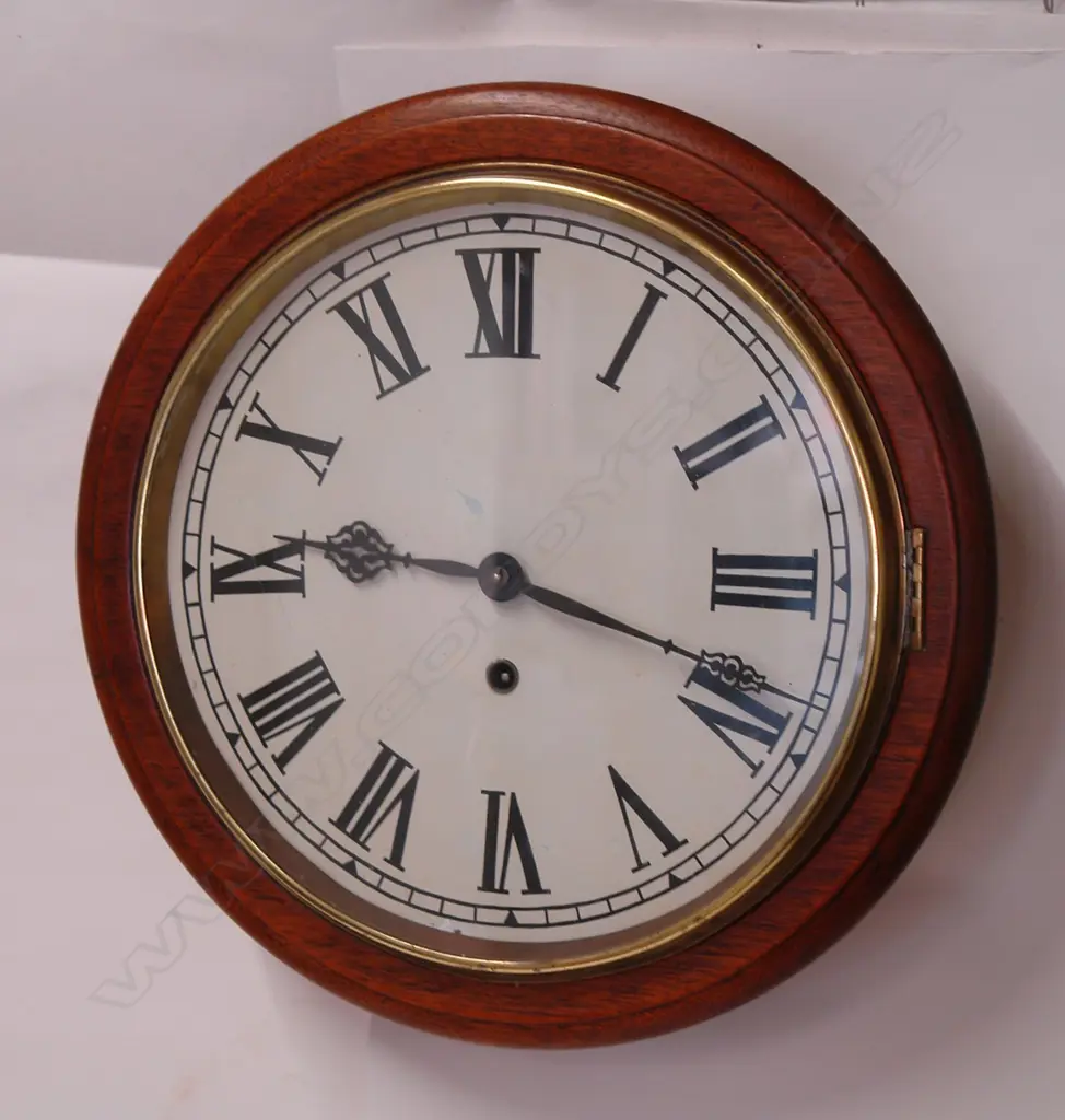 A c.1900 American mahogany framed circular school-type wall clock Image 1++