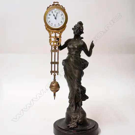 A 19thC French figural spelter mystery clock